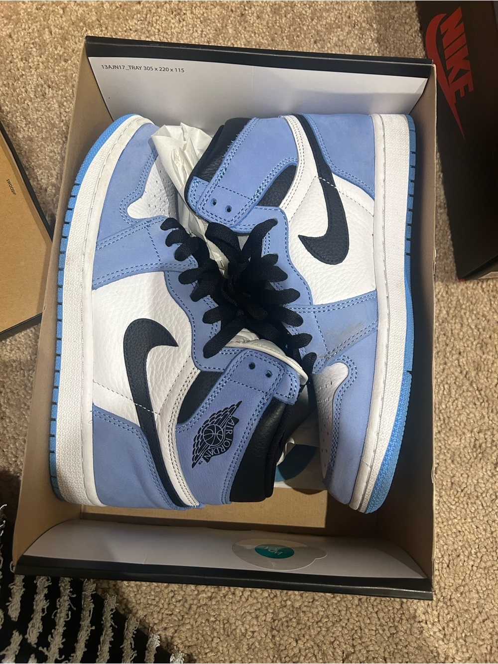 Jordan Mid Sneakers in University Blue, White and Black